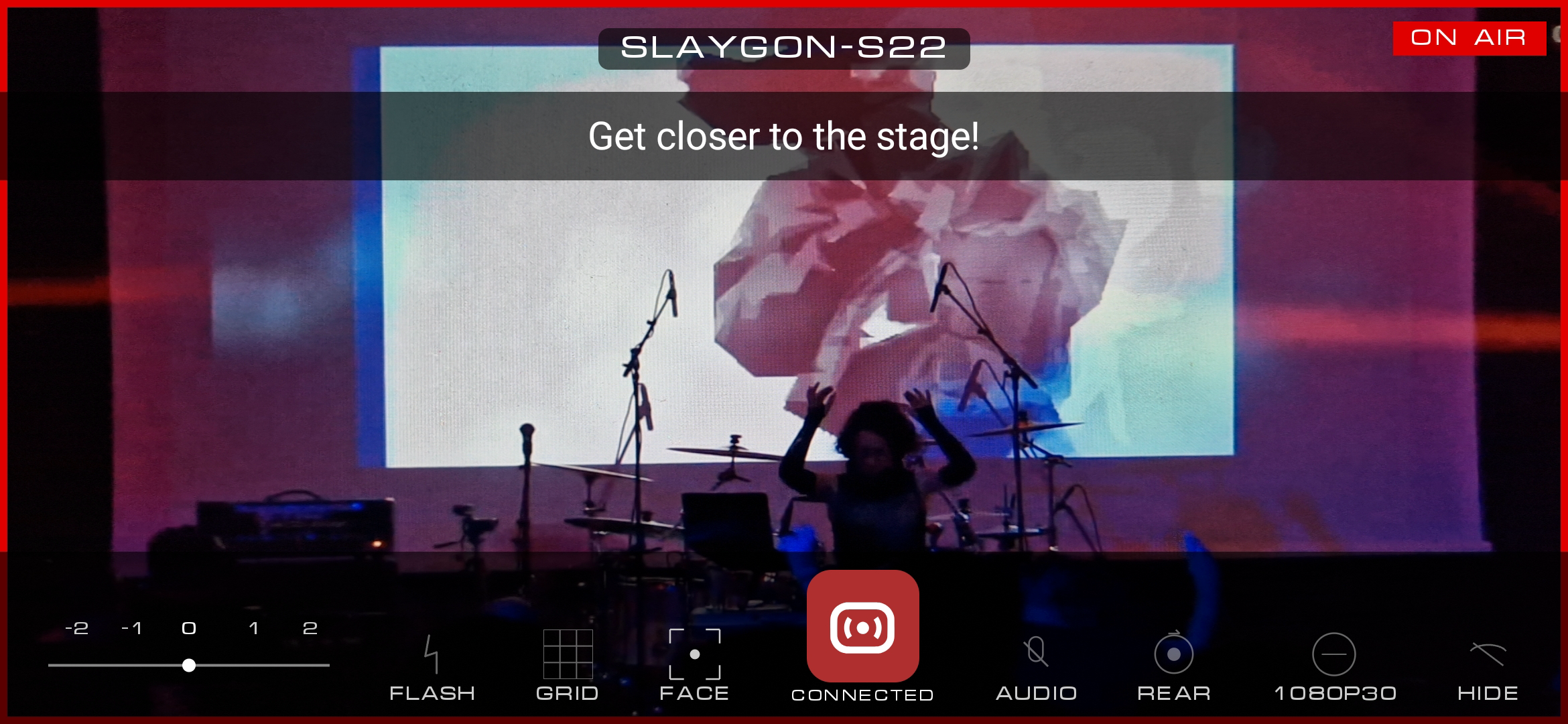 SLAY Camera showing an ON AIR tally and an operator message banner reading Get closer to the stage.